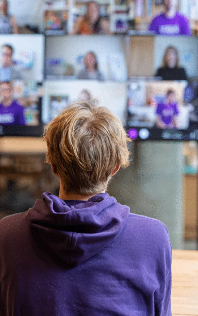 Person sitting in front of a teams call screen